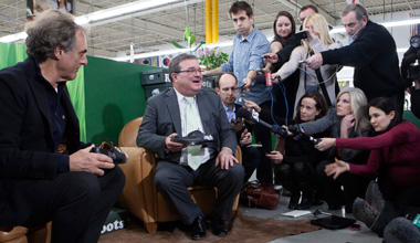 Minister Flaherty trying on new shoes